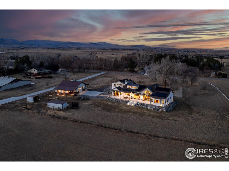 Nearly new house and large barn with 2 stalls and fenced in pen area.