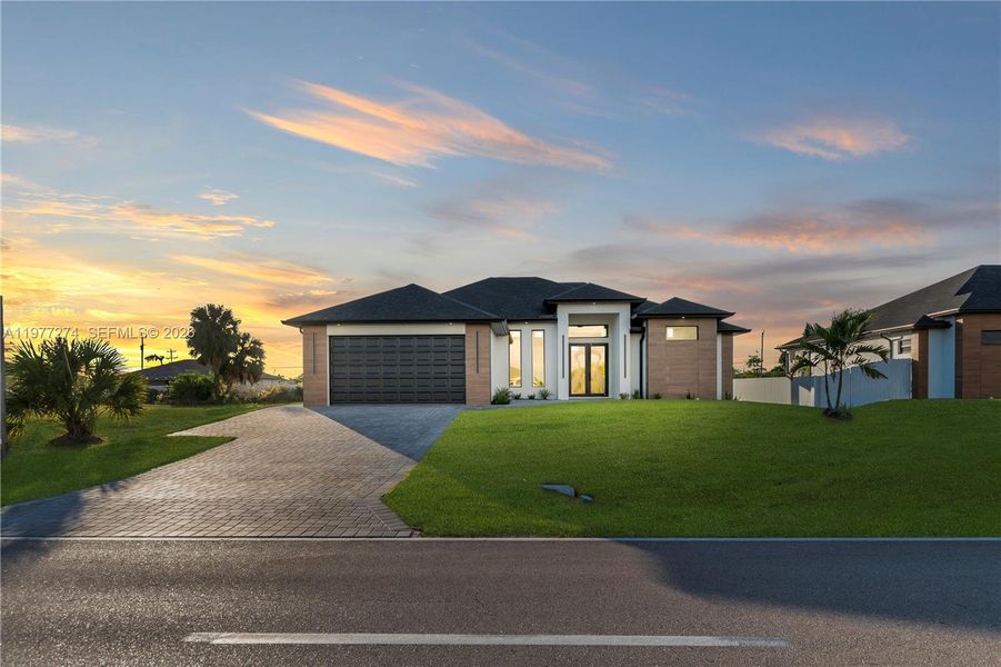 Front exterior of a new home in , Cape Coral, FL, highlighting curb appeal (Image 23).