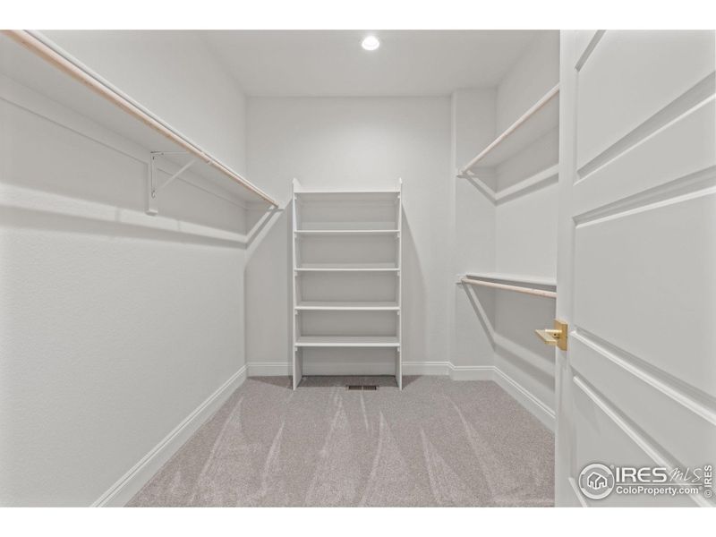 The large walk in clothes closet is at the back of the ensuite