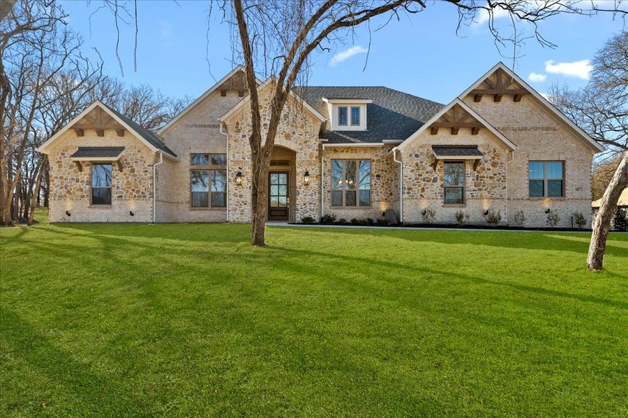 Front exterior of a new home in Brooks Meadow, Weatherford, TX, highlighting curb appeal (Image 1). Front exterior of a new home in Brooks Meadow, Weatherford, TX, highlighting curb appeal (Image 1).