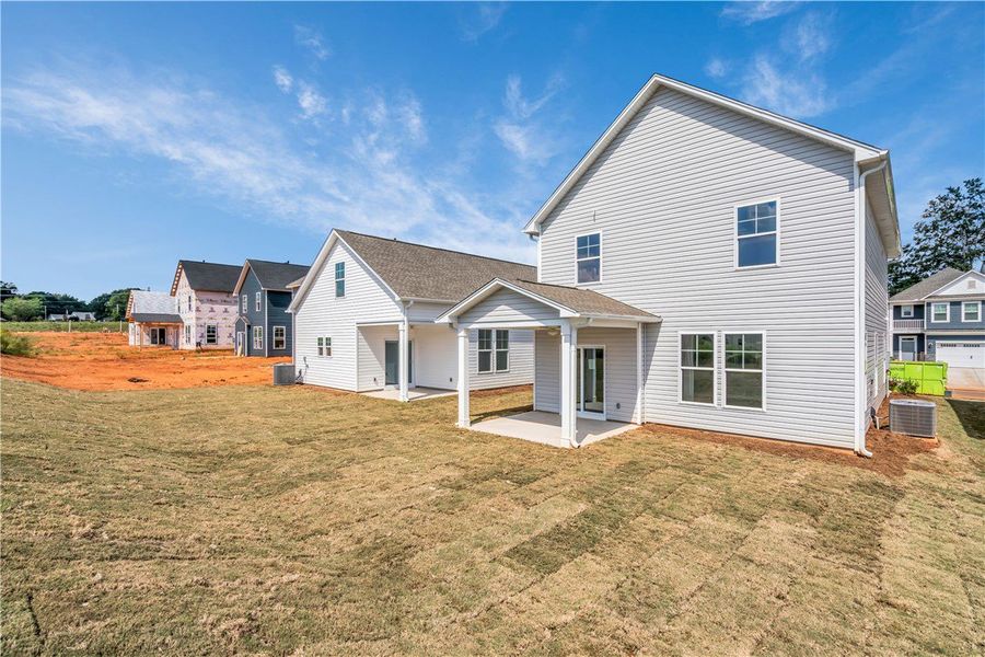 Front exterior of a new home in Brownstone Park, Easley, SC, highlighting curb appeal (Image 14).