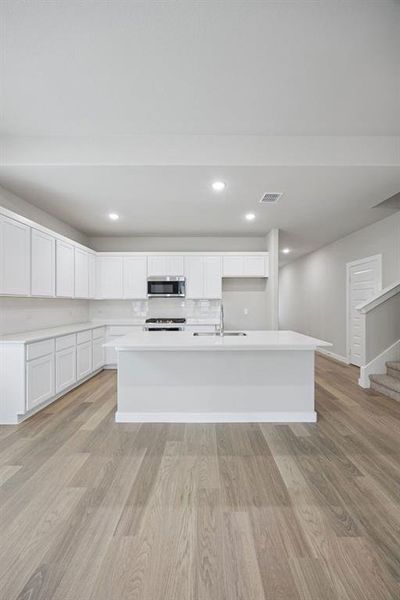 Kitchen in the Stanley II home plan by Trophy Signature Homes – REPRESENTATIVE PHOTO