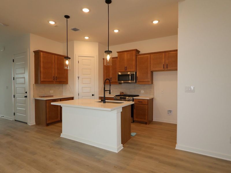 Furnished interior view inside a new home in Heritage, Dripping Springs (Image 6).