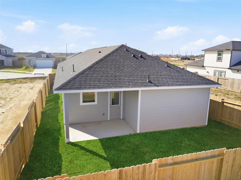 Exterior details and patio area of a home in Sweetgrass Village, Crosby (Image 4). Exterior details and patio area of a home in Sweetgrass Village, Crosby (Image 4).