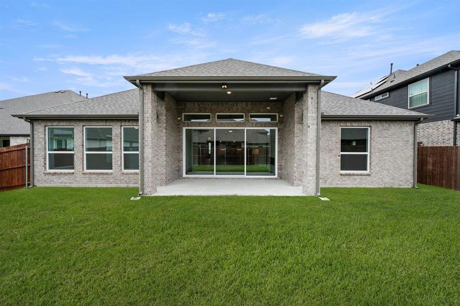 Exterior details and patio area of a home in High Country, Burleson (Image 3).