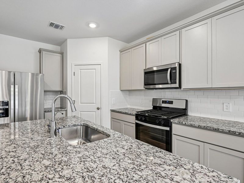 Furnished interior view inside a new home in Prairie Winds - Reserve Collection, Hutto (Image 5).