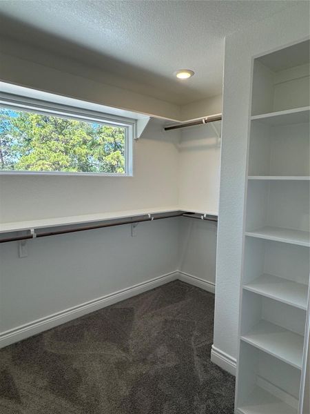 huge walk in closet primary bedroom on the 2nd floor