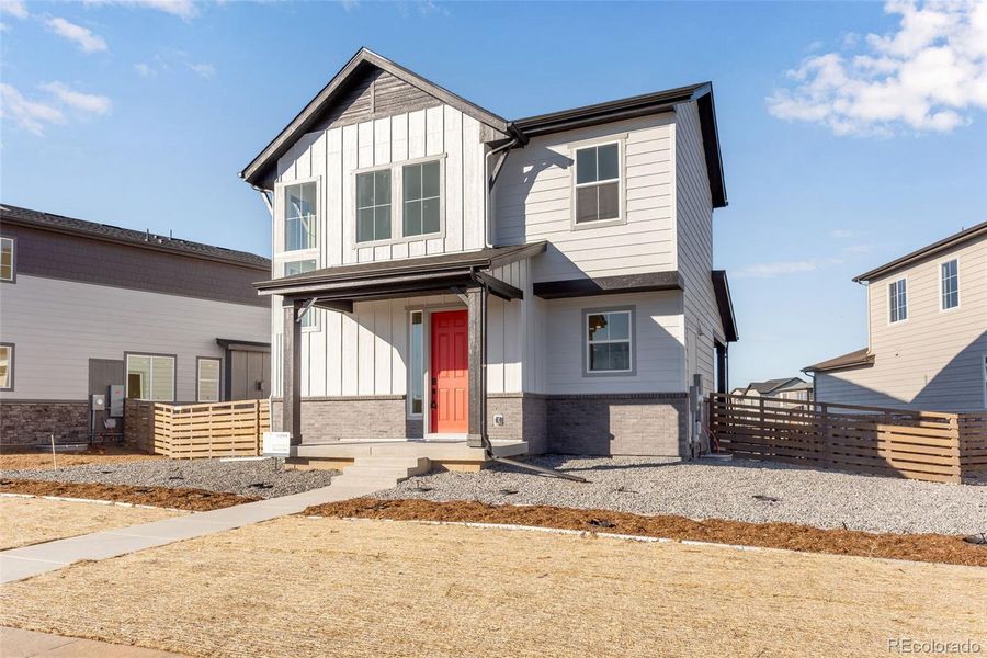 Front exterior of a new home in Painted Prairie, Aurora, CO, highlighting curb appeal (Image 2). Front exterior of a new home in Painted Prairie, Aurora, CO, highlighting curb appeal (Image 2).