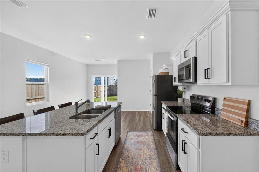 Furnished interior view inside a new home in Pender Woods at Cane Bay, Summerville (Image 15).