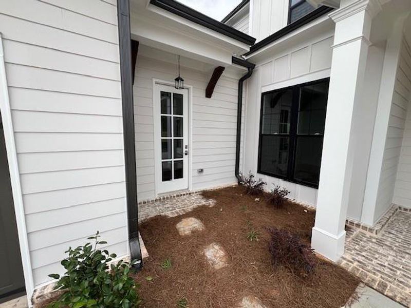 Exterior details and patio area of a home in Promenade at Sawnee Village, Cumming (Image 3). Exterior details and patio area of a home in Promenade at Sawnee Village, Cumming (Image 3).
