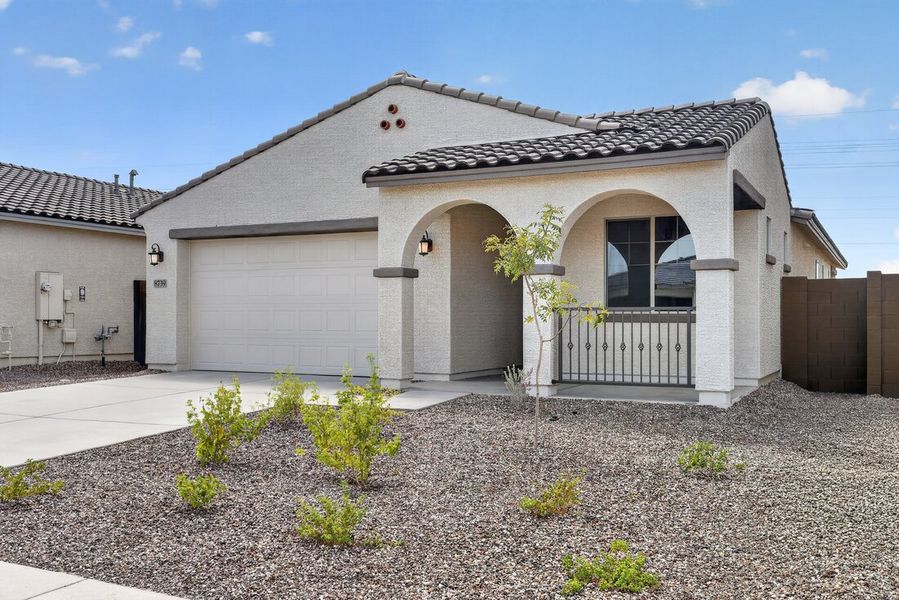 Front exterior of a new home in Stonehaven, Glendale, AZ, highlighting curb appeal (Image 22).