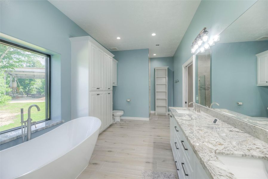 Bathroom with a stand-alone shower and separate bathtub as well as a double sink (Building B) Bathroom with a stand-alone shower and separate bathtub as well as a double sink (Building B)