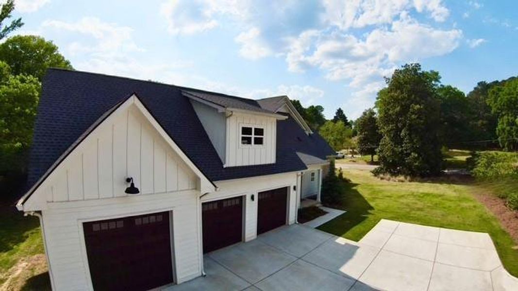 Front exterior of a new home in , Sugar Hill, GA, highlighting curb appeal (Image 27).