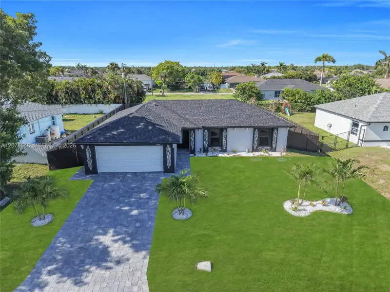 Front exterior of a new home in , Cape Coral, FL, highlighting curb appeal (Image 23).