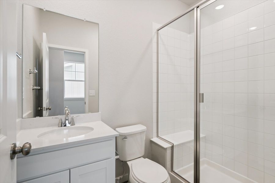 A bathroom with a glass shower.