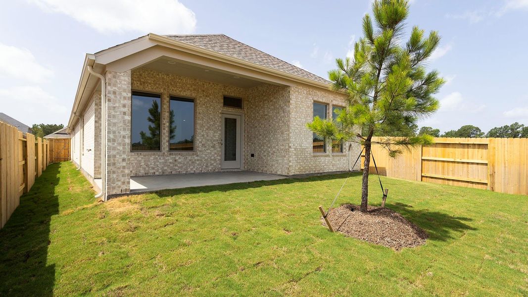 Exterior details and patio area of a home in Wildtree, Magnolia (Image 2).