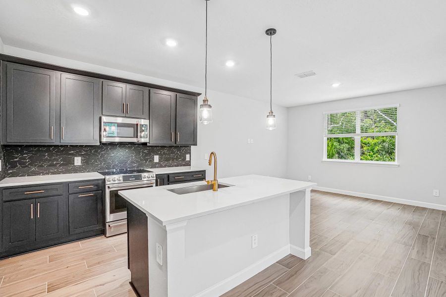 The kitchen features a spacious island The kitchen features a spacious island