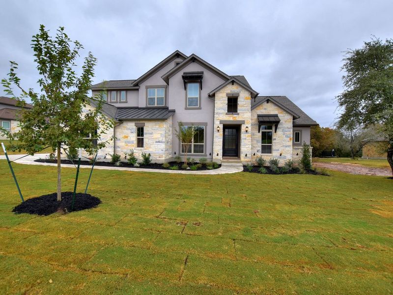 Representative exterior photo of a completed home built from the Madera II by Giddens Homes in Scofield Farms Estates, Georgetown, TX (Image 60).
