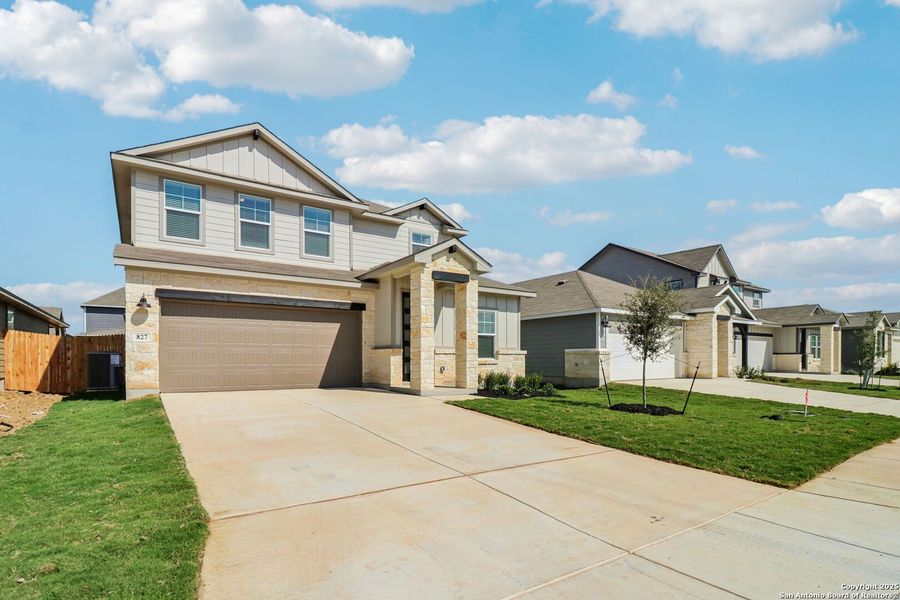 Front exterior of a new home in Estancia Ranch - Premier Series, San Antonio, TX, highlighting curb appeal (Image 1). Front exterior of a new home in Estancia Ranch - Premier Series, San Antonio, TX, highlighting curb appeal (Image 1).