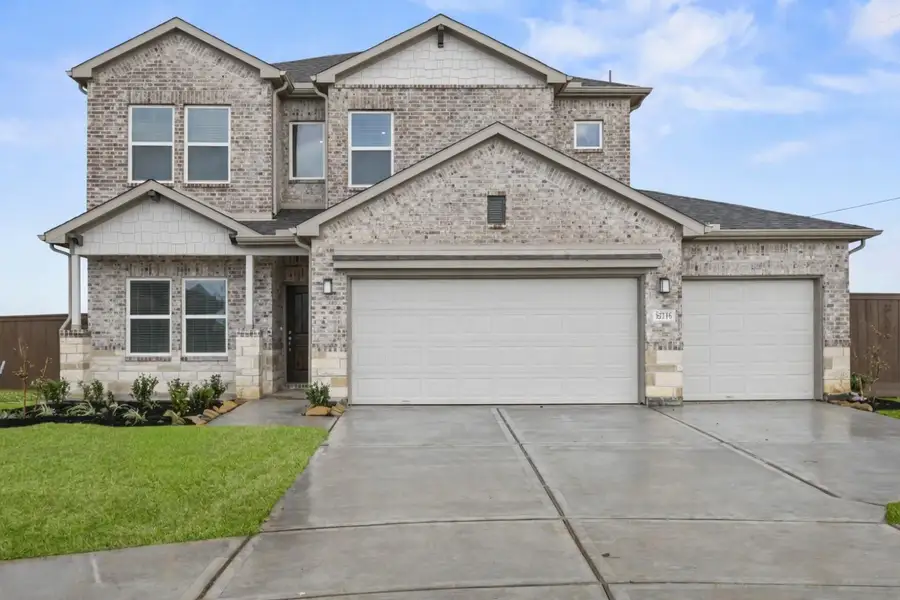 Front exterior of a new home in , Iowa Colony, TX, highlighting curb appeal (Image 1). Front exterior of a new home in , Iowa Colony, TX, highlighting curb appeal (Image 1).