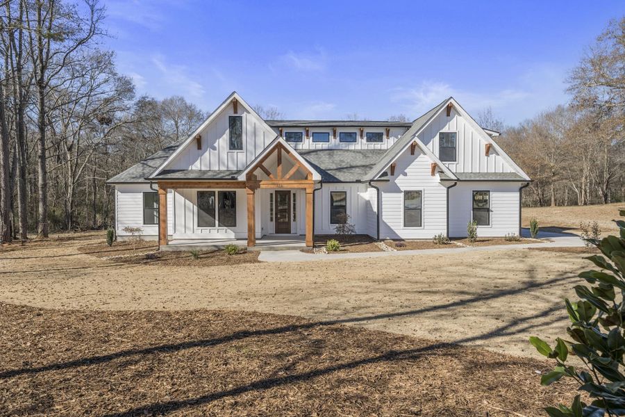 Front exterior of a new home in Long Bay Golf Club, Longs, SC, highlighting curb appeal (Image 21).