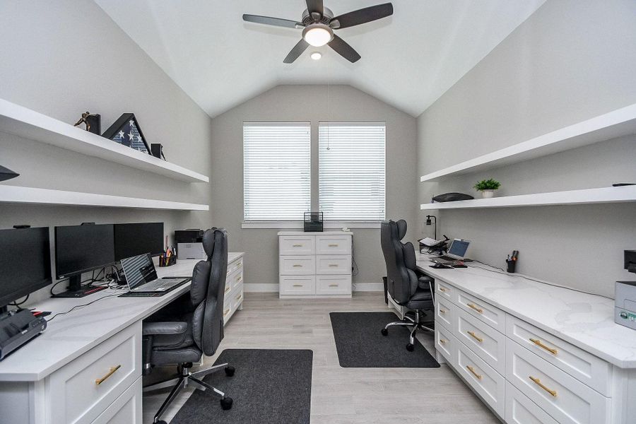 Spacious home office with custom built-ins, quartz counters, soft pull drawers and floating shelves. Spacious home office with custom built-ins, quartz counters, soft pull drawers and floating shelves.