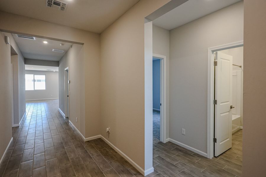 A hallway with white walls. A hallway with white walls.