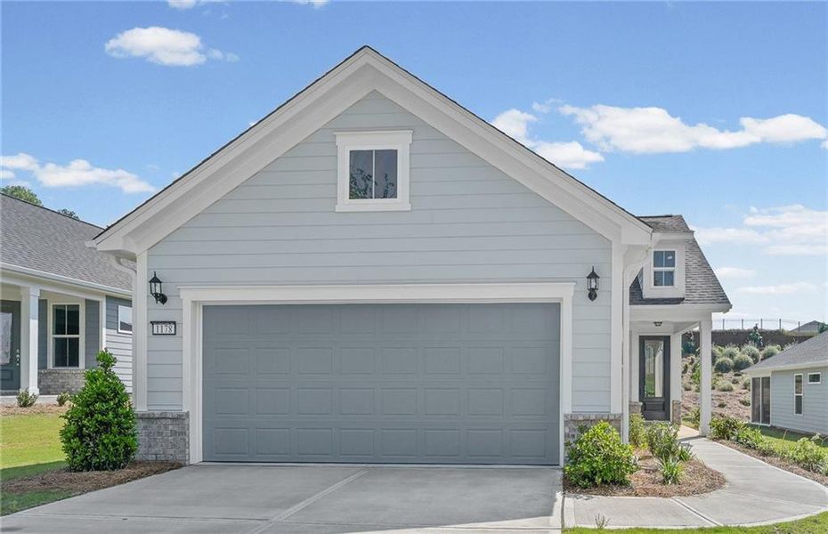 Front exterior of a new home in Del Webb at Lake Oconee, Greensboro, GA, highlighting curb appeal (Image 2). Front exterior of a new home in Del Webb at Lake Oconee, Greensboro, GA, highlighting curb appeal (Image 2).