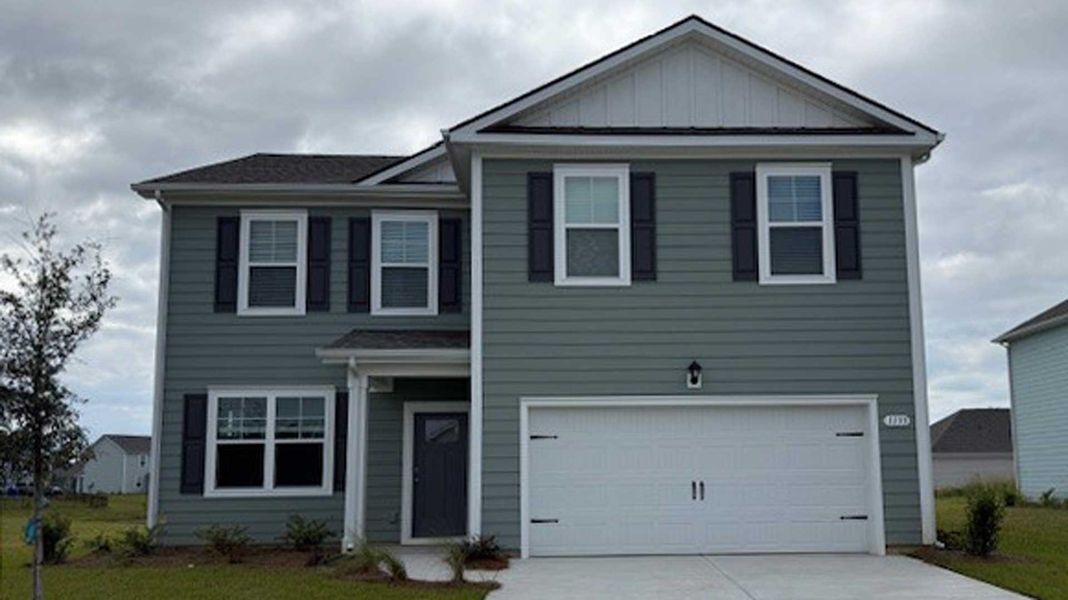 Front exterior of a new home in Kingston Bay, Conway, SC, highlighting curb appeal (Image 1). Front exterior of a new home in Kingston Bay, Conway, SC, highlighting curb appeal (Image 1).