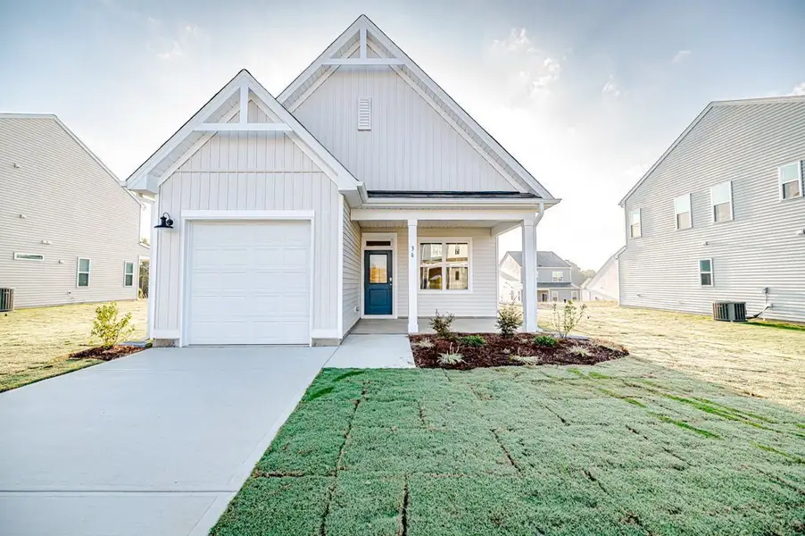 Representative exterior photo of a completed home built from the Jordan by McKee Homes in Sandy Springs, Aberdeen, NC (Image 9).