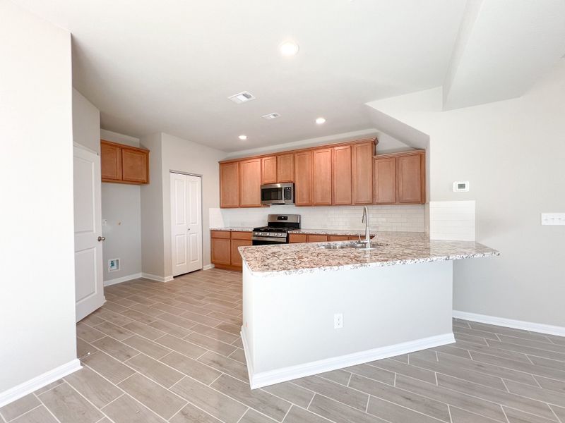 Representative furnished interior of a home built from the The Laura Belle Wallace II by Bigelow Homes in Creekside, Kyle (Image 8). Representative furnished interior of a home built from the The Laura Belle Wallace II by Bigelow Homes in Creekside, Kyle (Image 8).