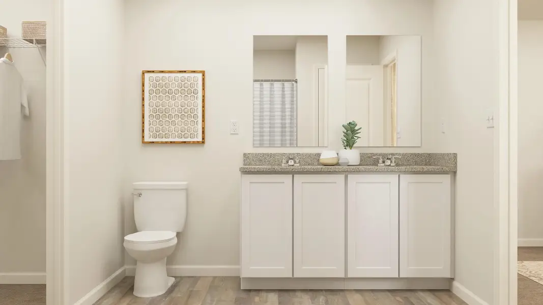 A bathroom with a toilet and sink.