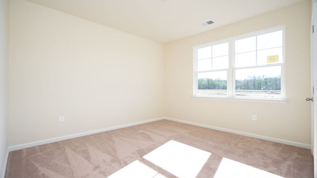 Representative unfurnished interior of a home built from the CALI by D.R. Horton in The Reserve at Wild Horse, Conway (Image 13).
