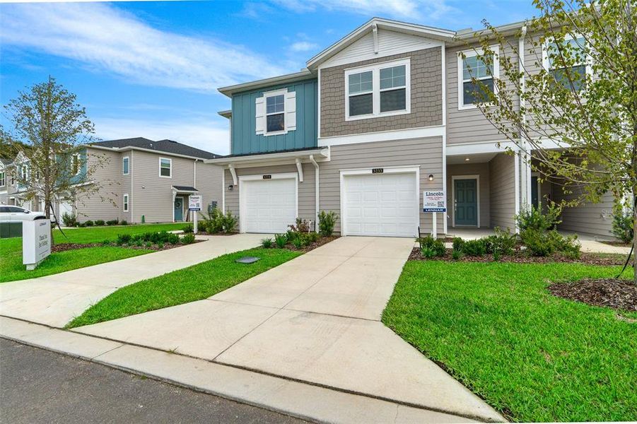 Front exterior of a new home in , Ocala, FL, highlighting curb appeal (Image 27).