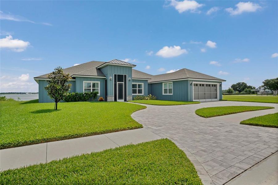 Front exterior of a new home in , Auburndale, FL, highlighting curb appeal (Image 23).