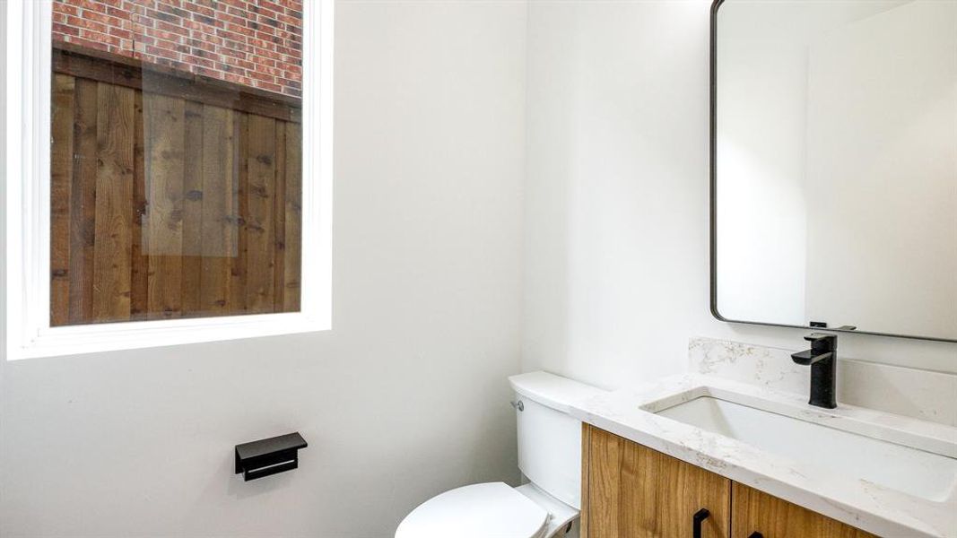 Bathroom featuring vanity and toilet