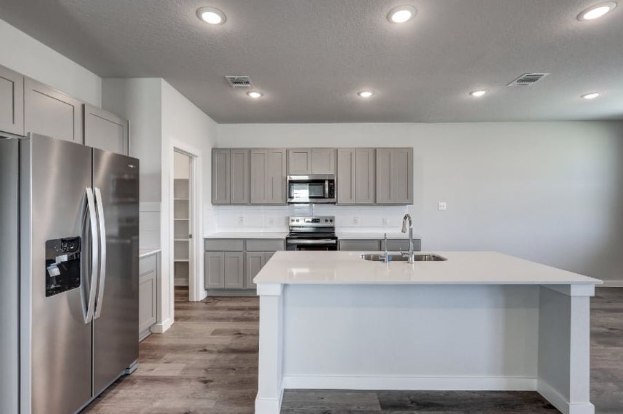 A kitchen with stainless steel appliances. A kitchen with stainless steel appliances.