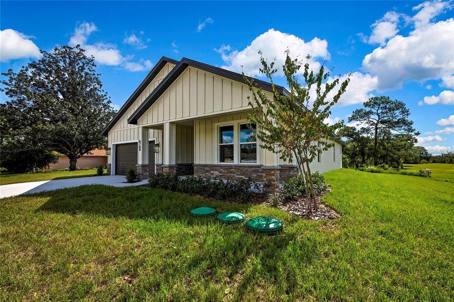 Front exterior of a new home in , Spring Hill, FL, highlighting curb appeal (Image 29).