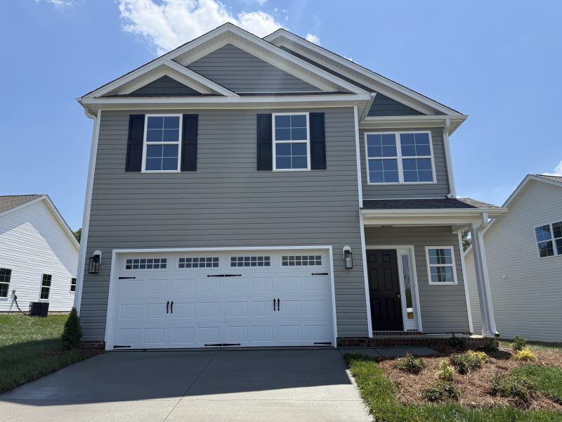Representative exterior photo of a completed home built from the Southport by Keystone Homes NC in Miller's Reserve, Greensboro, NC (Image 32). Representative exterior photo of a completed home built from the Southport by Keystone Homes NC in Miller's Reserve, Greensboro, NC (Image 32).