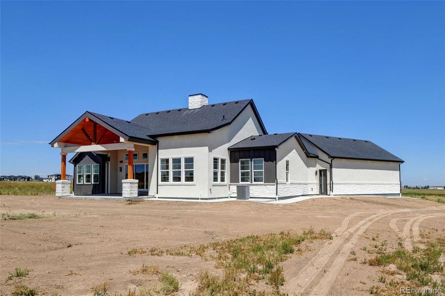Front exterior of a new home in , Brighton, CO, highlighting curb appeal (Image 2).