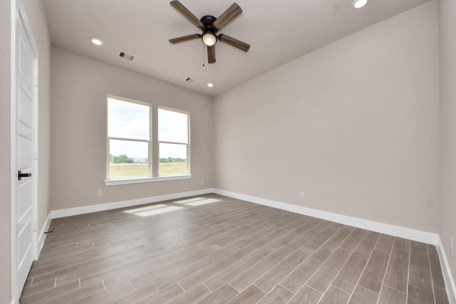 A modern, two-story home with a spacious driveway and a two-car garage. The exterior features a mix of light siding and dark accents, complemented by a neatly landscaped front path. Offering a serene and inviting atmosphere. A modern, two-story home with a spacious driveway and a two-car garage. The exterior features a mix of light siding and dark accents, complemented by a neatly landscaped front path. Offering a serene and inviting atmosphere.