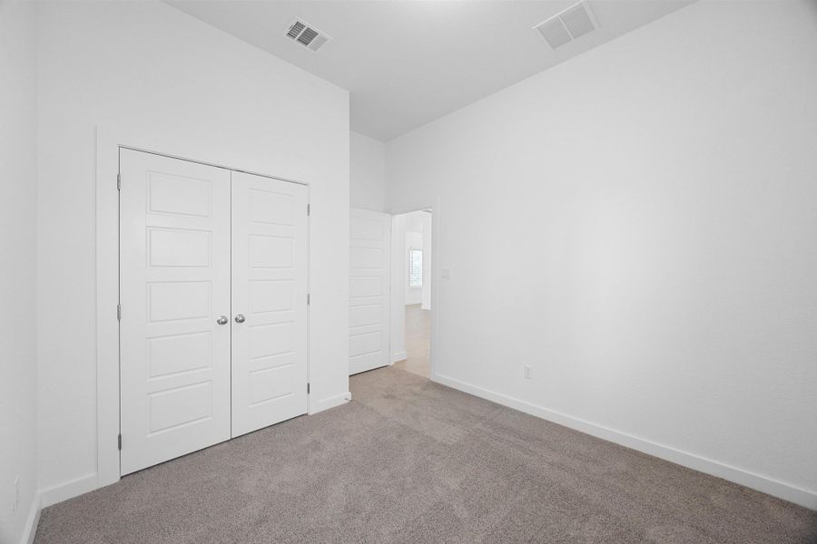 Bedroom in the Pecan II home plan by Trophy Signature Homes – REPRESENTATIVE PHOTO Bedroom in the Pecan II home plan by Trophy Signature Homes – REPRESENTATIVE PHOTO