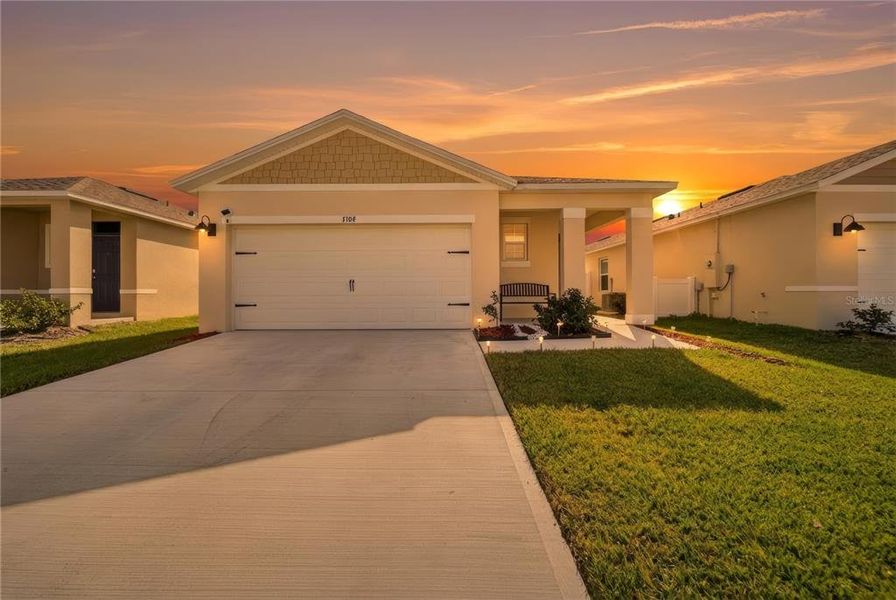Front exterior of a new home in , Harmony, FL, highlighting curb appeal (Image 20). Front exterior of a new home in , Harmony, FL, highlighting curb appeal (Image 20).