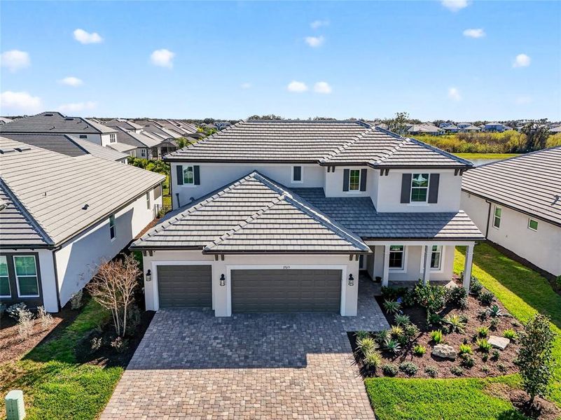 Front exterior of a new home in , Bradenton, FL, highlighting curb appeal (Image 21).