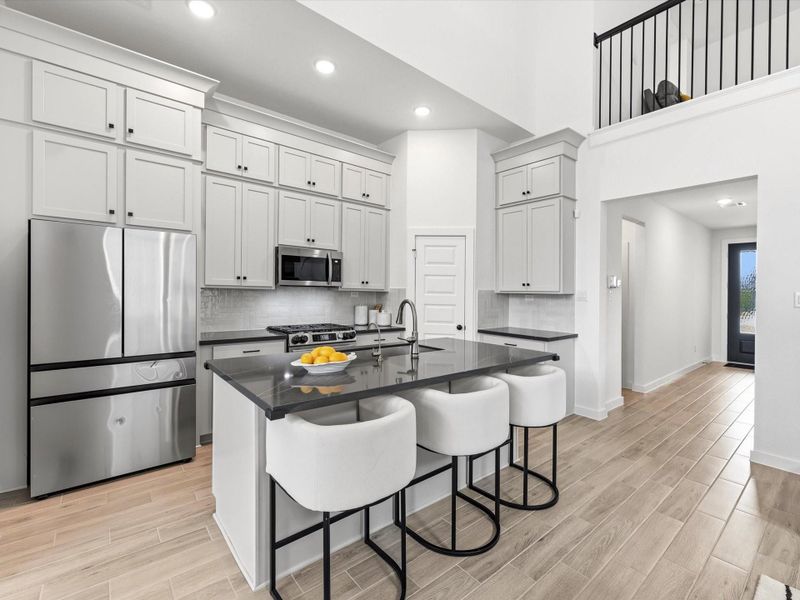 No one is left out or closed in! Even those upstairs can participate in the conversation from the cat-walk with wrought-iron balusters. No one is left out or closed in! Even those upstairs can participate in the conversation from the cat-walk with wrought-iron balusters.