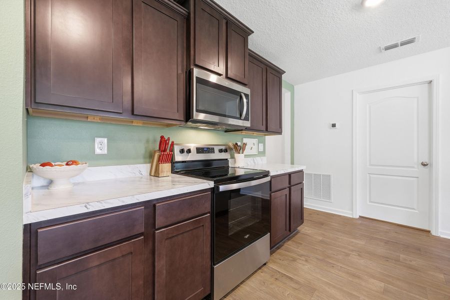 Furnished interior view inside a new home in Willow Springs, Green Cove Springs (Image 40).