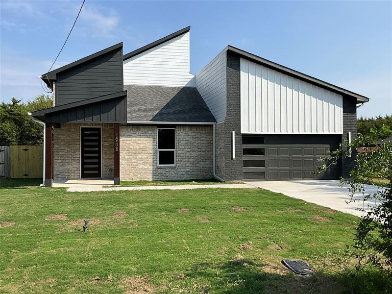 Front exterior of a new home in , Greenville, TX, highlighting curb appeal (Image 15). Front exterior of a new home in , Greenville, TX, highlighting curb appeal (Image 15).