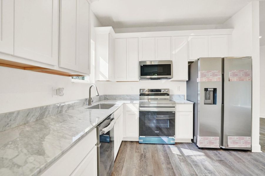 Furnished interior view inside a new home in , Lantana (Image 8).