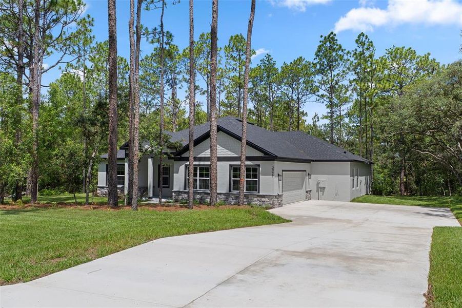 Front exterior of a new home in , Hernando, FL, highlighting curb appeal (Image 1). Front exterior of a new home in , Hernando, FL, highlighting curb appeal (Image 1).