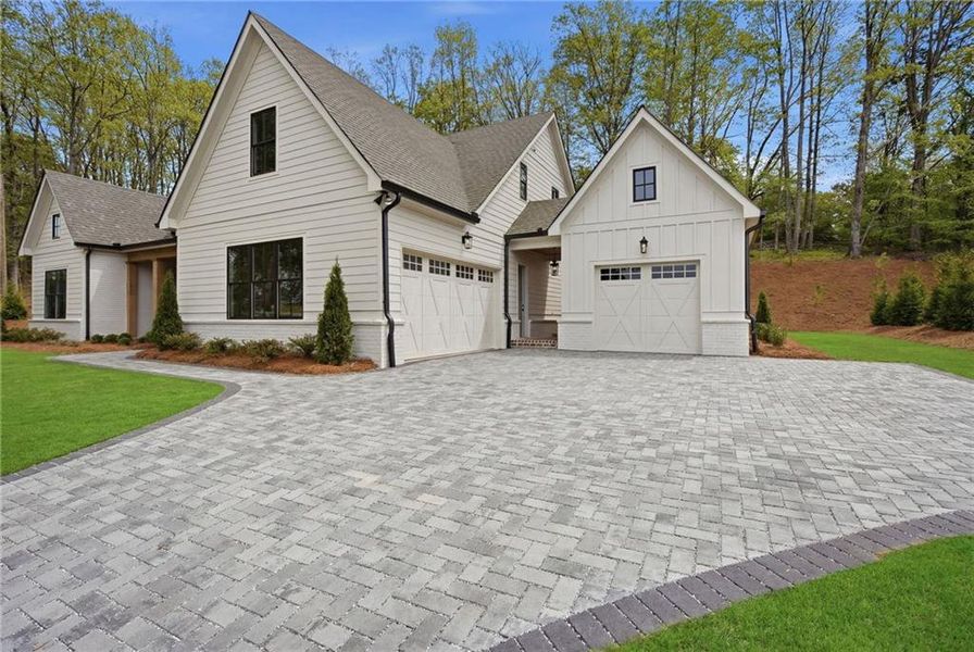 Front exterior of a new home in , Cumming, GA, highlighting curb appeal (Image 18). Front exterior of a new home in , Cumming, GA, highlighting curb appeal (Image 18).
